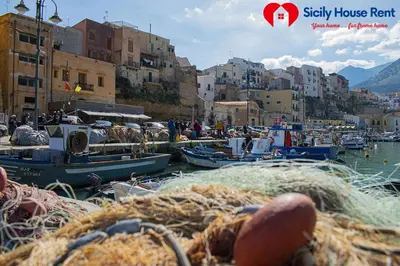 a group of boats in a harbor with buildings at Borgo Aranci - Appartamento in Villa Garofalo - 15B in Castellammare del Golfo