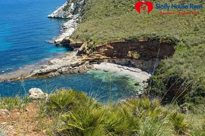 a view of the ocean and a rocky beach at Borgo Aranci - Appartamento in Villa Garofalo - 15B in Castellammare del Golfo