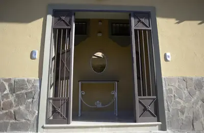a front door of a building with a mirror on it at Le Case di Ninni in Palermo