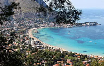 a view of a beach with boats in the water at LuminHouse Mondello Zibibbo in Mondello