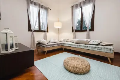 a living room with a couch and a hat on the floor at LuminHouse Mondello Limone in Mondello