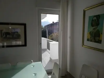 a room with a door leading to a balcony at Near the beach in Palermo