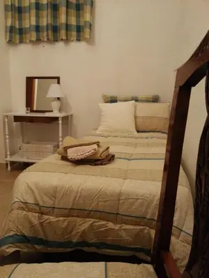 a bedroom with a bed with a mirror and a bed sidx sidx sidx at Casa dolce Casa in Sambuca di Sicilia