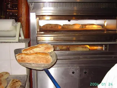 an oven filled with lots of loaves of bread at Agriturismo La Targa in Buonfornello