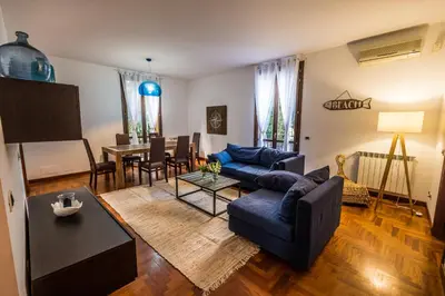 a living room with a couch and a table at LuminHouse Villa Mondello in Mondello