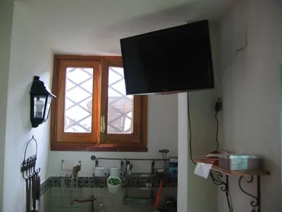 a flat screen tv hanging from a wall at Appartamento Vivaldi in Mondello