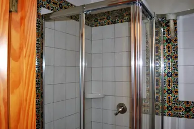 a shower in a bathroom with a shower curtain at Appartamento Vivaldi in Mondello
