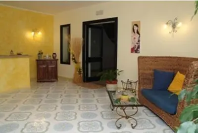 a living room with a couch and a table at Torre Salina in Macari
