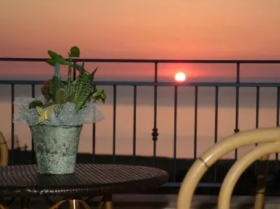 a potted plant sitting on a table on a balcony at Torre Salina in Macari