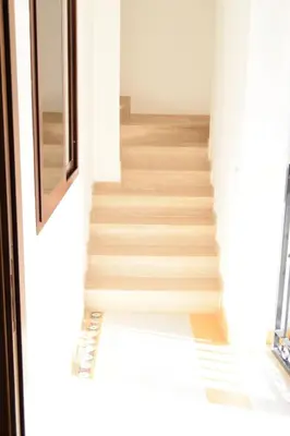 a staircase in a house with wooden floors at Le Volte - Locazione Turistica in Terrasini