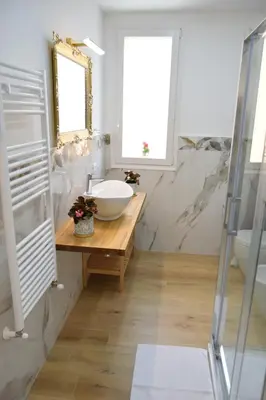 a bathroom with a sink and a mirror at Caporama in Terrasini