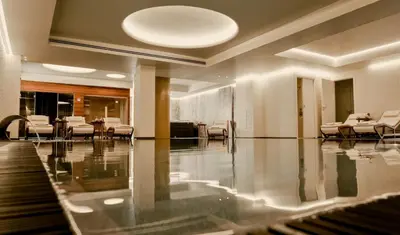 a lobby with a dining room with tables and chairs at Il Baglio Della Luna Relais by Le Dhome Sicily in Balestrate