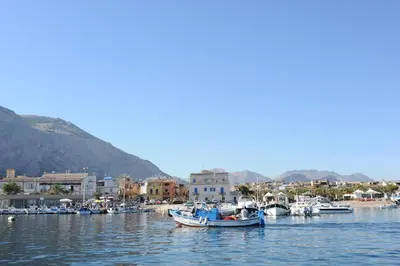a group of boats are docked in a harbor at Casa Genna in Isola delle Femmine