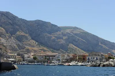 a group of houses and boats on a body of water at Casa Genna in Isola delle Femmine