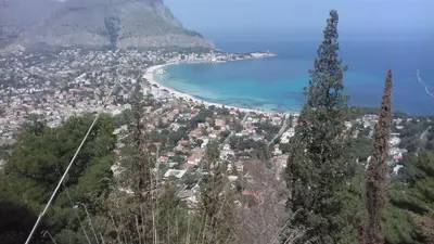 a view of a city with a beach and a mountain at Principessa Jolanda in Mondello