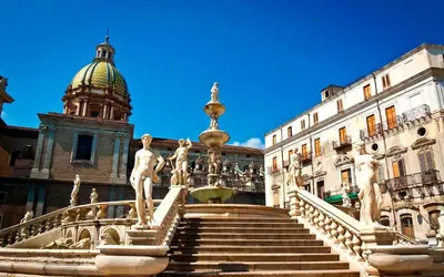 a fountain in front of a building with a dome at Bellaroto Suite & Spa - Charming Boutique Rooms in Palermo