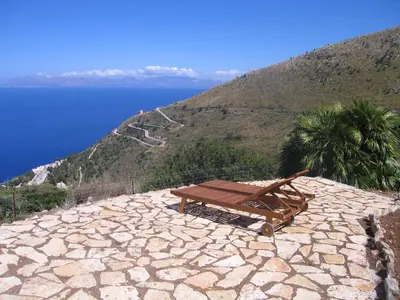 a garden with a view of the ocean at Baglio La Luna - B&B in San Vito lo Capo