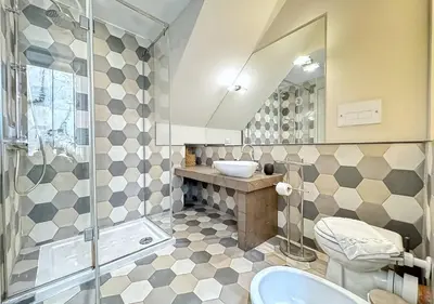 a bathroom with a toilet and a sink and a shower at Solemar Sicilia - Valuan Luxury Home in Palermo