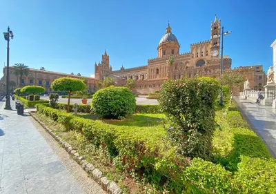 a large building with a garden in front of it at Solemar Sicilia - Valuan Luxury Home in Palermo