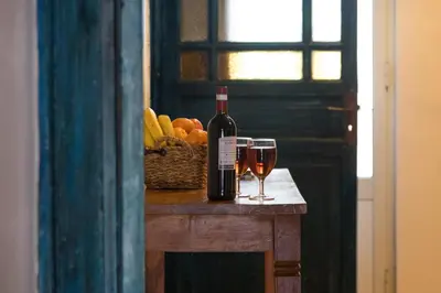 a kitchen with a sink and a red refrigerator at Large terrace apartment near Politeama in Palermo