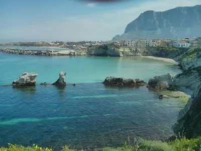 an aerial view of a city with water and mountains at Apartment in the center in Terrasini