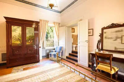 a room with a door and a desk and a window at Masseria Rossella in Piana degli Albanesi