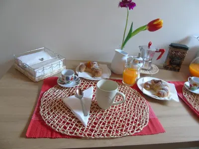 a table with a plate of food on a table at Casa Arenella appartamento con parcheggio privato in Palermo