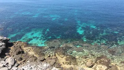 an overhead view of the ocean with rocks and reefs at Casa Gagà in Sferracavallo