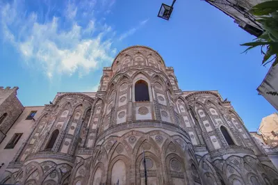 a large cathedral building with a blue sky in the background at Vivere la Ciambra in Monreale