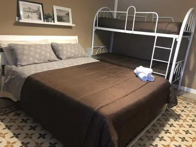 a bedroom with a bunk bed with a teddy bear on it at Jennys place in Palermo