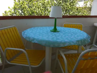 a table with a lamp on top of it at Il Mulino in San Vito lo Capo