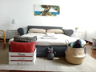 a bedroom with a bed and a pile of boxes at Casa Tea: nel cuore del centro storico in Palermo