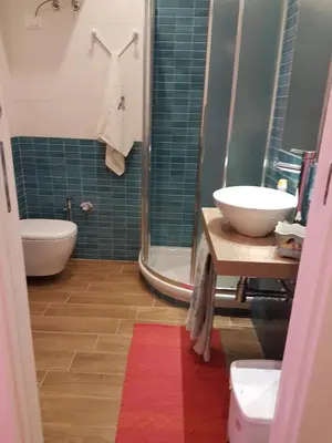 a bathroom with a sink and a toilet and a shower at La Rosa dei Venti in Isola delle Femmine