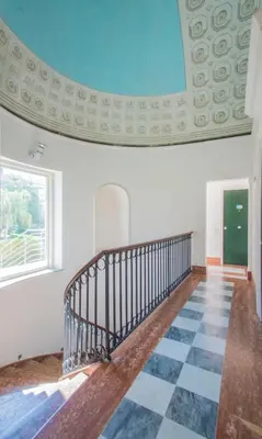 a staircase in a room with a checkered floor at Casa Gelsomino in Palermo