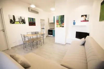 a living room with a couch and a table at ArtHouse in San Vito lo Capo