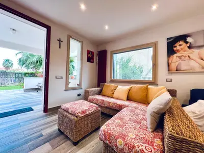 a living room with a couch and a table at Casa di Ivana in Carini