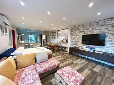 a living room with a couch and a flat screen tv at Casa di Ivana in Carini