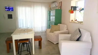 a living room with a couch and a table at Casa Calendule in Alcamo Marina