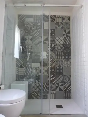 a bathroom with a glass shower with a toilet at Casa Calendule in Alcamo Marina