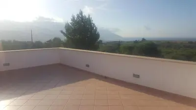 a balcony with a view of a mountain at Villa Plaia in Castellammare del Golfo