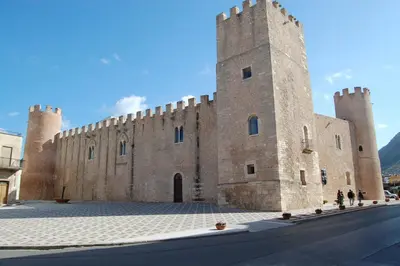 a large castle with two towers on a street at Ficodì apartments in Alcamo