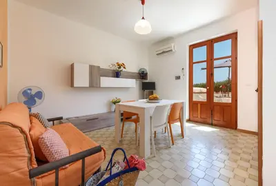 a living room with a couch and a table at Casa Vacanza Azzurra 3 in San Vito lo Capo