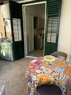 a table with a bowl on it in a kitchen at Holiday mondello martina in Mondello
