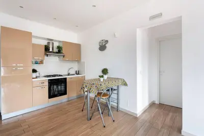 a kitchen with a table and chairs in a room at Frank's house - appartamento con terrazzo in centro in Palermo