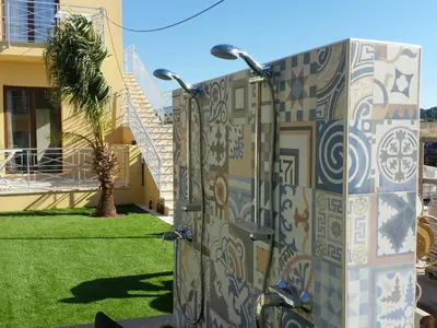 a utility box with a mural on the side of a house at Residence Le Piscine in San Vito lo Capo