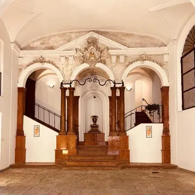 an empty hall with a staircase in a building at Natoli Apartments in Palermo