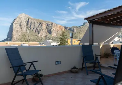 a staircase with black railings in a home at Casa Vacanze Monacò in San Vito lo Capo