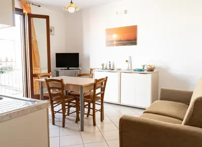 a bedroom with a bed with two towels on it at Casa Vacanze Monacò in San Vito lo Capo