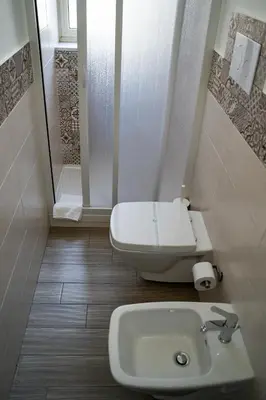 a bathroom with a toilet and a sink at Le Due Sicilie B&B in Lascari