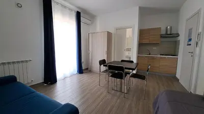 a living room with a couch and a table and chairs at Le Due Sicilie B&B in Lascari